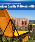 Versatile Folding Outdoor Chair For Camping And Lawn With Dual Lock System shown in bright orange against canyon backdrop.