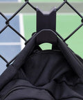 Chain Link Fence Hook For Sports Bags With Paracord Lanyard Heavy Duty Fence Hanger For Baseball Softball Tennis And Pickleball Gear Keeps Gear Clean Off The Ground During Games And Practices hanging a bag on a chain-link fence at a sports court