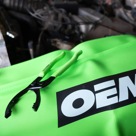 Beefy Oil Filter Pliers For Tight Spots, Adjustable Jaw Fits Two And A Half Inch To Four And Five Eighths Inch Filters on neon surface