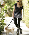 Women Mid Calf Waterproof Garden Rain Boots With Killer Traction And Legit All Day Comfy Support Insole For Yard Work Or Rainy Days Snazzy Black And White Polka Dot Style Made Stateside True To Size, worn outdoors while walking a dog.