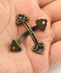 Close-up of a Vintage Mini Drawer Pull in bronze zinc alloy held in hand, part of a 20 Pack Bronze Zinc Alloy Antique Style Handles with Mounting Screws.