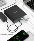27000mAh AC 130W Portable Laptop Charger With TSA Approval connected to multiple devices showing pass-through charging