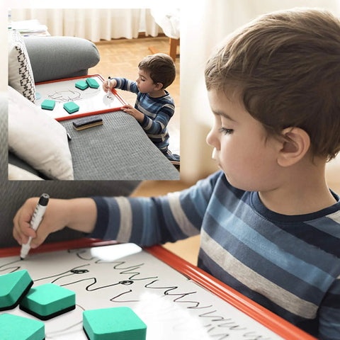 Child using Magnetic Whiteboard Erasers 48 Pack For Kids And Classrooms, green 2x2 inch erasers, writing on a board at home.