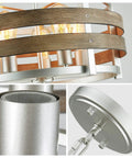 5 Light Metal Drum Chandelier With Wood Grain Shade, nickel finish, close-up on bulb fittings and chain components, E26 base.