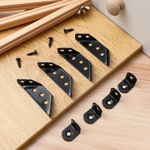 Stainless Steel Corner Brackets For Tables And Cabinets Beefy Heavy Duty Angle Braces with screws on wooden surface.