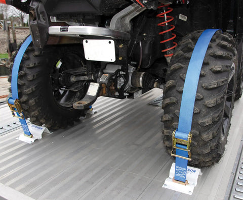 Built Tough To Keep Your Rig Locked Down With Heavy Duty E Track Wheel Chock Tie Down Kit Featuring Two 2 X 6 5 Foot Ratchet Straps And Four Powder Coated Chocks For Safely Hauling ATVs Or Mowers, showcasing secured ATV tires with blue straps and chocks.