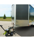 Tow Tuff Electric Trailer Dolly With 3500 Lb Capacity shown with a utility trailer on smooth surface for easy hauling.