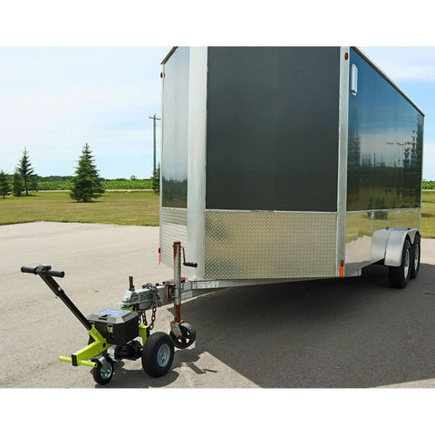 Tow Tuff Electric Trailer Dolly With 3500 Lb Capacity shown with a utility trailer on smooth surface for easy hauling.