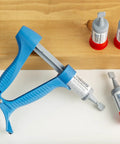 Drywall Repair Kit With Built In Spatula Tool And Two 20ml Spackling Paste Cartridges, reusable caps, DIY wall patch laid on table