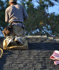 Heavy Duty Roofing Cushion With Killer Traction And Heat Blocking Kneeler Mat for a roofer kneeling on a steep roof.
