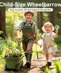 Kids holding gardening tools and wheelbarrow with flowers in forest, part of the Kids Gardening Tools And Bug Catcher Kit Two In One