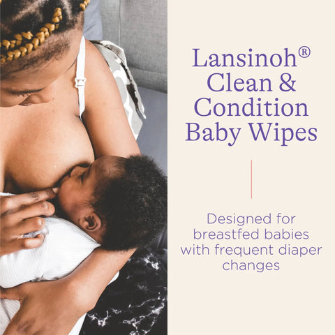 Mother breastfeeding baby with Lansinoh Clean & Condition Baby Wipes packaging visible, ideal for diaper changes and sensitive skin.