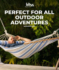 Man relaxing in Caribbean Hammock With Pillow For Easy Chill Sessions 48 Inch Wide Poolside Patio Backyard Relaxer Includes Straps And Chains Eco Friendly Polyester And Cotton Blend 265 Pound Capacity Nautical Stripe outdoors