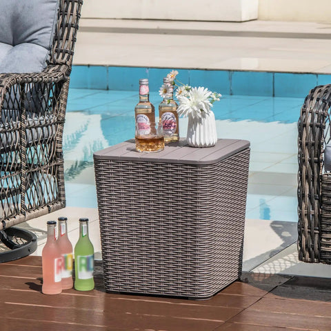 11.5 Gallon Waterproof Deck Box With Removable Lid And Faux Rattan Side Table For Outdoor Patio Storage All Weather Furniture And Extra Seating Poolside Brown next to pool with drinks on top