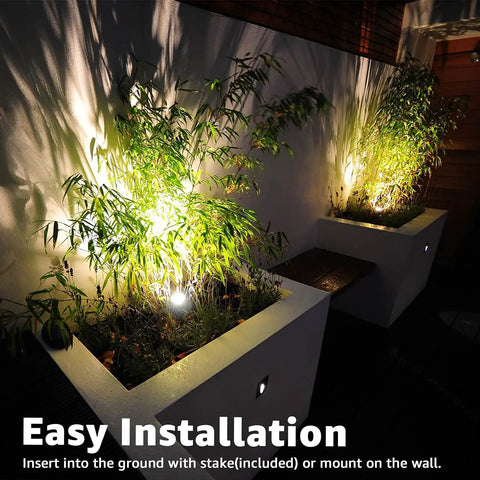 Two Pack Indoor LED Spot Lights for Plants and Decor with 120V Warm White 3000K Glow illuminating potted plants outdoors at night