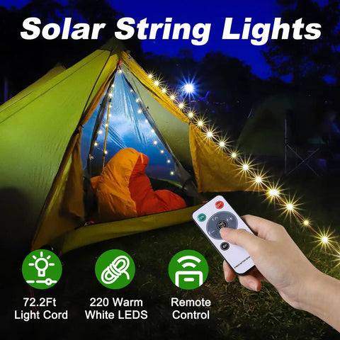 Hand holding remote next to tent lit by 4 In 1 Solar Camping String Lights With Remote Control And Extra Long 72.2 Ft LED String 220 LEDs USB