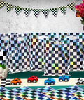 50 Pack Iridescent Checkered Race Car Party Favor Bags displayed with toy cars and decorative banner