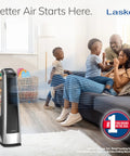 Family enjoying cool comfort from High Velocity Oscillating Tower Fan with Remote Timer and 3 Speed Settings in living room.