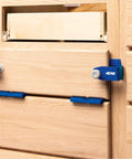 No Hassle Magnetic Setup And Spacer Shims For Pinpoint Drawer Alignment Durable Plastic Carpenter Blocks being used on wooden drawers.
