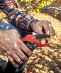 Person using Ratcheting Hand Pruner For Thick Stems And Branches, Three-Quarter Inch Cut Capacity Garden Pruning Shears With Comfortable Grip