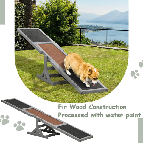 A dog on a 71 Inch Outdoor Dog Agility Seesaw for Training and Exercise made of slip-resistant fir wood in a backyard.