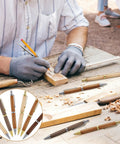 Sick 6 Piece Retractable Pen Kit Bundle Sweet Deal For Wood Turning Lathes Includes 8 MM Slimline Insert Kits With Smooth Click Refills. Woodworker using pens on a workshop table.
