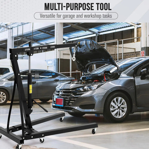 Smooth Rolling Heavy Duty 2 Ton Engine Hoist Foldable Hydraulic Shop Crane With Telescopic Boom in garage lifting car engine.