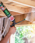 Person using foam gun to apply Expandable Polyurethane Spray Foam Insulation for Superior Heat And Sound Control.