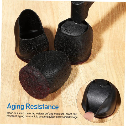 Close-up of Ten Pack Caster Cups For Rolling Furniture Nonslip Floor Protectors TPE Wheel Stoppers on wood surface.