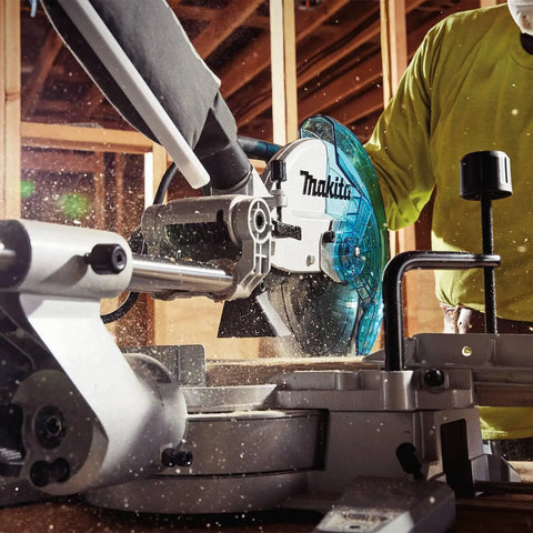 Worker using Beefy 10 Inch Slide Compound Miter Saw With 4500 RPM Direct Drive Motor Left And Right Bevels From 0 To 47 Degrees Positive Stops At 0 15 22.5 31.6 45 And 47 Lightweight About 36 Pounds For Easy Job Site Portability And Precise Cuts for cutting wood