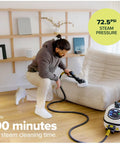 Heavy Duty Commercial Steam Cleaner With Slick Storage Bag Delivers Consistent Low Moisture Dry Vapor For Kick Ass Janitorial Hospitality And Auto Detailing Jobs At Any Venue in use, cleaning a sofa.