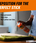 Person using Heavy Duty Spray Adhesive Clear Glue 14 Oz All Purpose Bond For Glass Plastic Wood Metal Ceramic Rubber Leather Paper