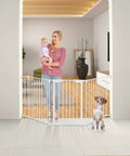 Woman with child stands near Extra Wide Baby Gate With Door Kid Safe For Stairs And Hallways Hardware Mounted in living room.