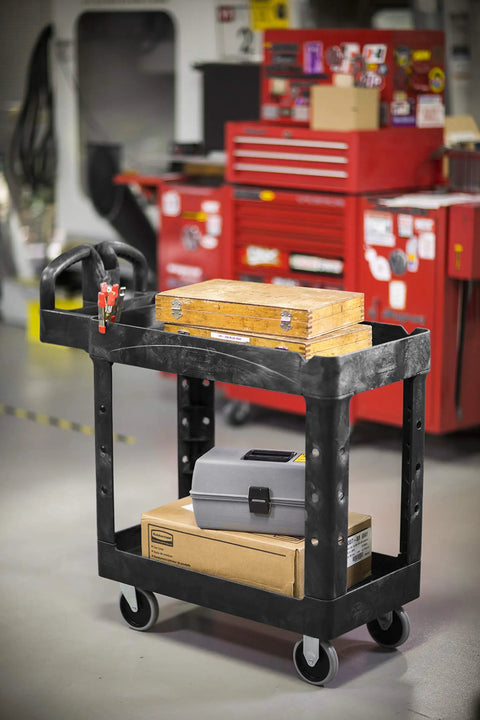 Top Tier Heavy Duty Two Shelf Utility Cart With Durable Structural Foam Lipped Trays And Smooth Glide Handles 500 Lb Capacity loaded with tools in garage.