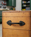 3 Pack Heavy Duty Cast Iron Barn Gate Handles with Aged Iron Finish mounted on wooden door in workshop