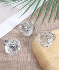 Top view of three Six Pack Crystal Cabinet Knobs With Flower Glass Handles 1.4 Inch Diameter Clear Crystal With Brushed Gold Bases