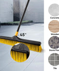 Heavy Duty 24 Inch Push Broom With Adjustable Telescoping Handle Up To 65 Inches on a floor, showing bristles at a 45° angle.
