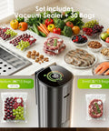 Portable Handheld Vacuum Sealer With LED Pressure Display beside vacuum-packed fruits and meats on kitchen counter.