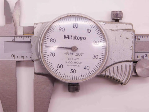 Close-up of 0-6 Inch Dial Caliper With Inside And Outside Measuring,.001 Inch Graduation, Dual Range Stainless Steel Precision Tool shown