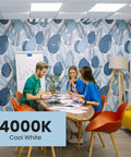 Three people working at a table under U-Bend LED Tube Light 15W T8 Replaces 32W Fluorescent U-Bend, cool white 4000K light.