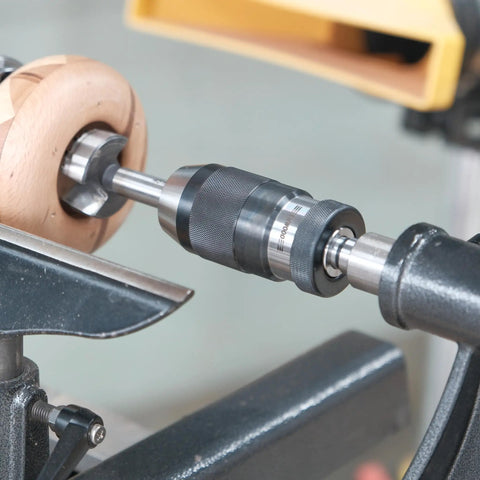 Heavy Duty Five Eighth Inch Keyless Drill Chuck With MT2 Shank for wood lathe in use, showing knurled hand grip and B16 taper