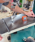 Bandsaw Table Precision Alignment Tool With Magnetic Digital Angle Mount in use on a bandsaw table for blade alignment.