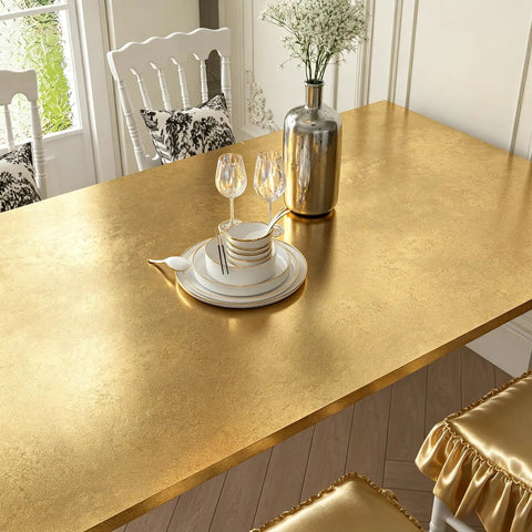 Image of Dope Gold Peel And Stick Wallpaper Thick Metallic Wallcovering covering a dining table, showcasing a sleek finish.