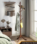 Freestanding Bamboo Coat Rack With 8 Hooks, Adjustable Height Entryway Stand in bedroom with classic brown finish.