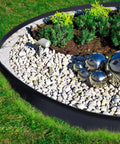 Landscape Edging Kit 33 Foot Roll 4 Inch Plastic Garden Edging With 100 Spikes for lawns featuring neat garden border.