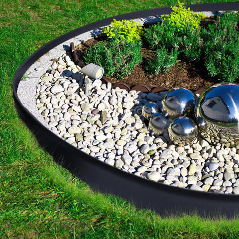 Landscape Edging Kit 33 Foot Roll 4 Inch Plastic Garden Edging With 100 Spikes for lawns featuring neat garden border.