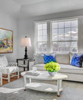 Living room with Resin Table Lamp Set Of 2 With USB Ports, black base, white fabric shade, on side table beside sofa.