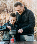 Father and son using Camping Cookware 18 Piece Mess Kit With Backpacking Stove outdoors