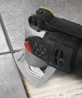 Oscillating tool using a diamond flush cut blade for tile repair, part of Six Piece Diamond Oscillating Saw Blade Set For Grout Removal