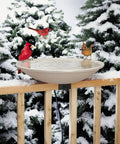 Dang Solid Heated Bird Bath Locks Tight To Deck Railings Frost Proof Stone Basin 150w Heater with cardinals in snow.